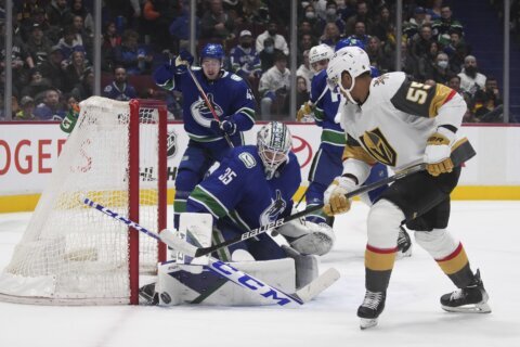 Hughes scores early in OT, Canucks top Golden Knights 5-4