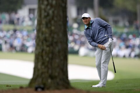 Scheffler survives wild, windy cold day to lead Masters by 3