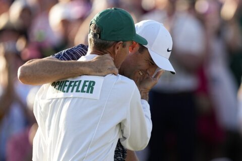 Caddie champ: Ted Scott gets to be part of a 3rd Masters win