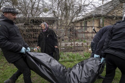 AP PHOTOS: The artist retrieving bodies in Ukraine’s Bucha