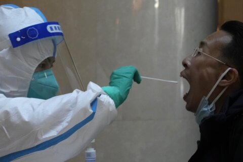 Shanghai wrestles with food shortages under virus shutdown