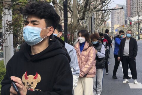 Shanghai allows 4 million more people out of their homes as virus restrictions ease