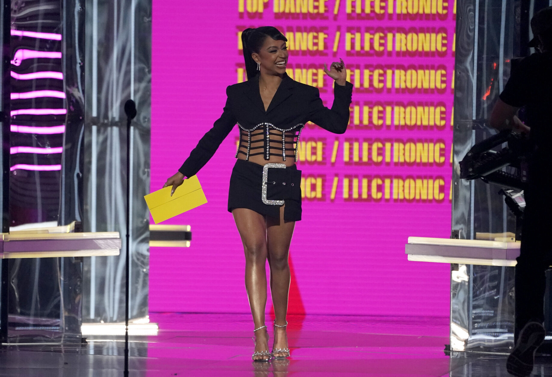 Liza Koshy walks onstage to present the award for Top Dance/Electronic Album at the Billboard Music Awards on Sunday, May 15, 2022, at the MGM Grand Garden Arena in Las Vegas. (AP Photo/Chris Pizzello)