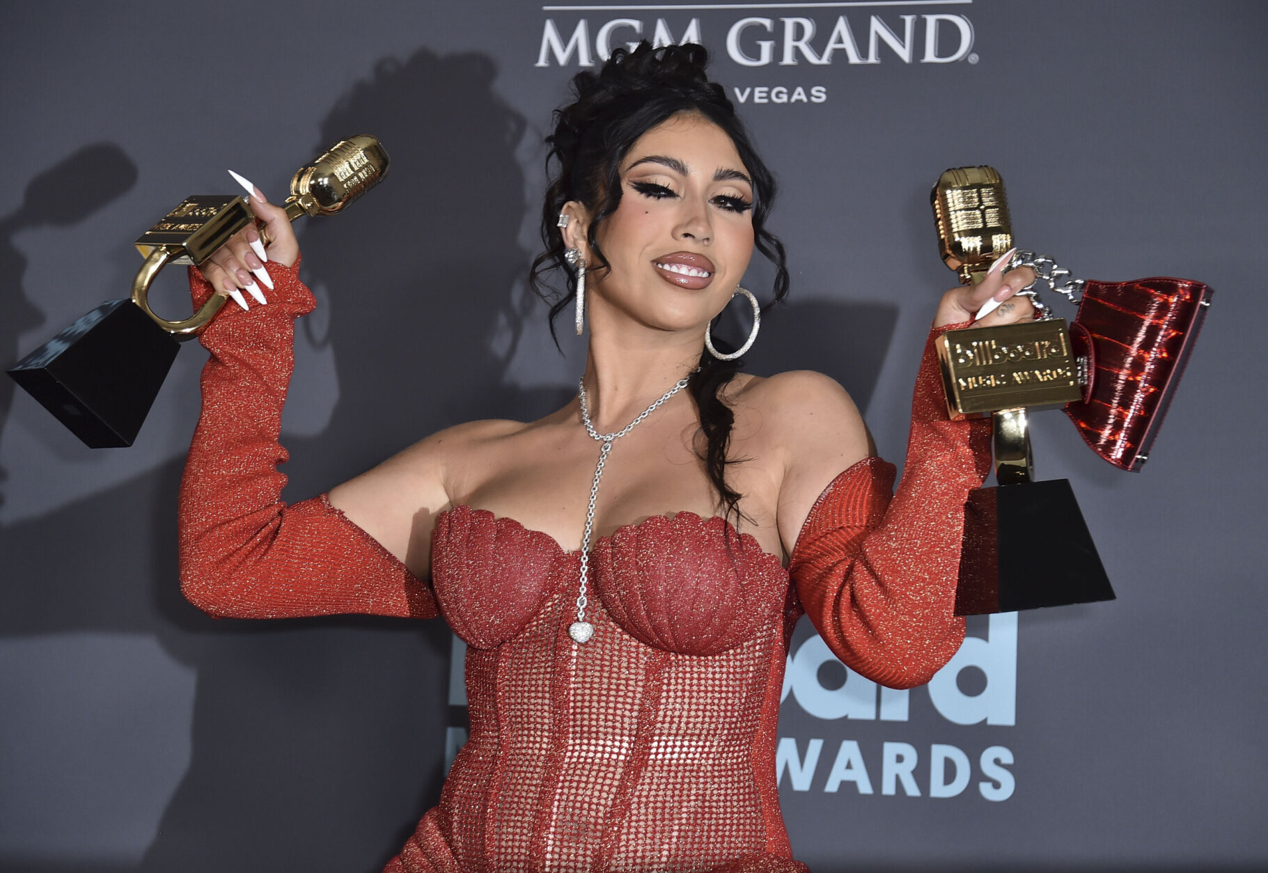 Kali Uchis poses in the press room with the awards for Top Latin Artist and Top Latin Female Artist at the Billboard Music Awards on Sunday, May 15, 2022, at the MGM Grand Garden Arena in Las Vegas. (Photo by Jordan Strauss/Invision/AP)
