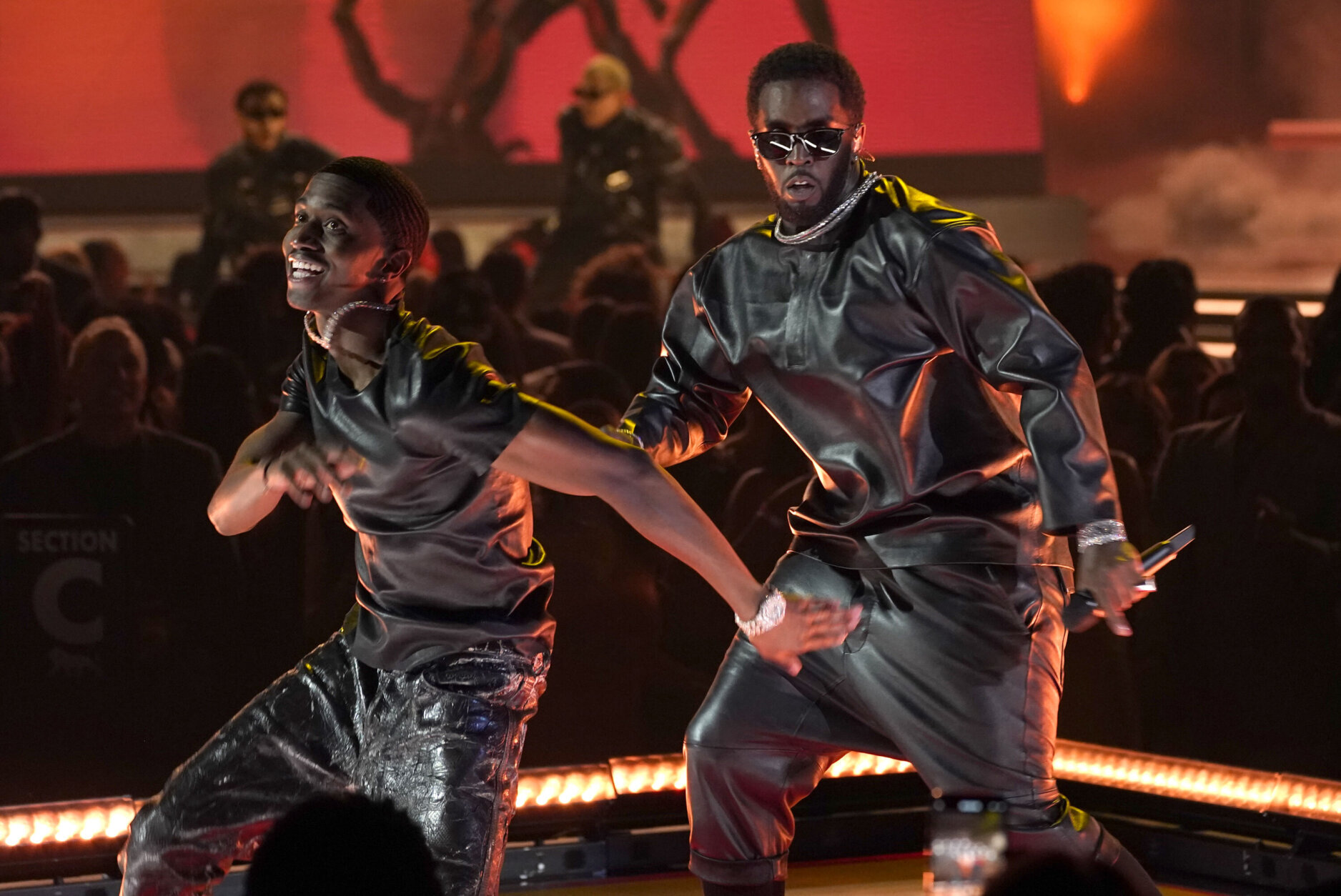 Sean "Diddy" Combs, right, and Christian Combs perform at the Billboard Music Awards on Sunday, May 15, 2022, at the MGM Grand Garden Arena in Las Vegas. (AP Photo/Chris Pizzello)