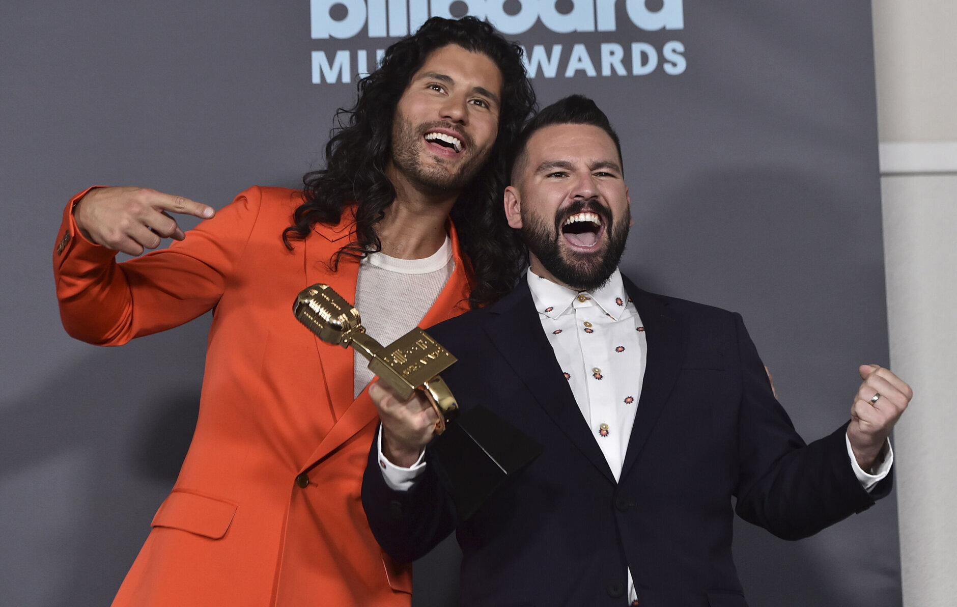 Dan Smyers, left, and Shay Mooney of Dan + Shay pose in the press room with the award for top country duo or group at the Billboard Music Awards on Sunday, May 15, 2022, at the MGM Grand Garden Arena in Las Vegas. (Photo by Jordan Strauss/Invision/AP)