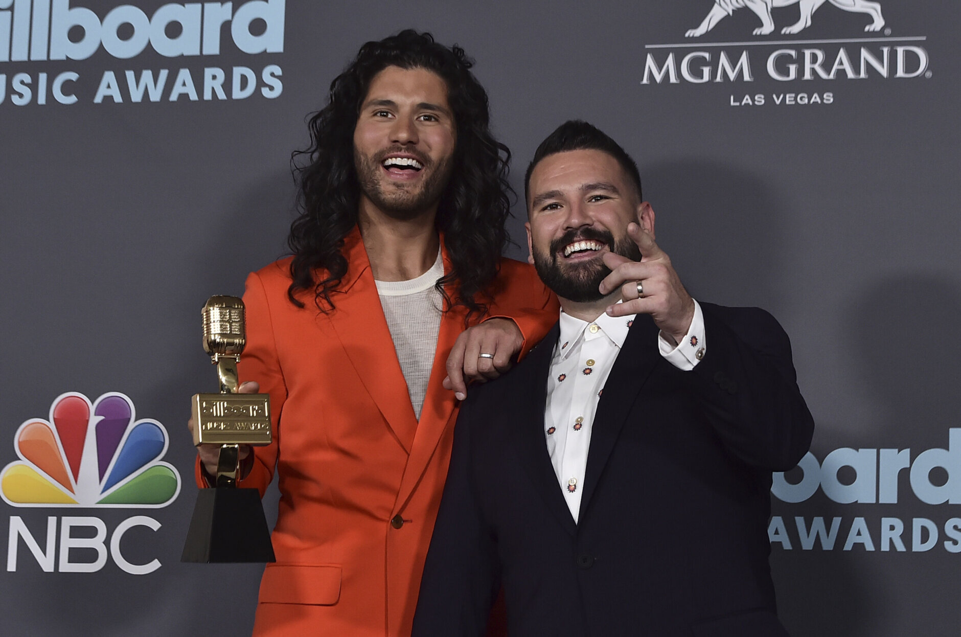 Dan Smyers, left, and Shay Mooney, of Dan + Shay, pose in the press room with the award for top country duo or group at the Billboard Music Awards on Sunday, May 15, 2022, at the MGM Grand Garden Arena in Las Vegas. (Photo by Jordan Strauss/Invision/AP)