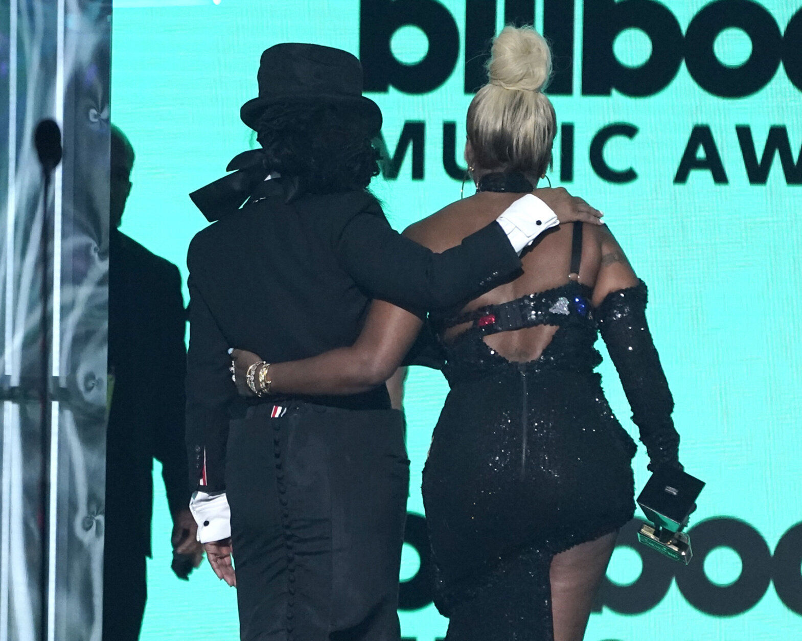Presenter Janet Jackson, left, and Mary J. Blige walk offstage after the presentation of the Icon Award at the Billboard Music Awards on Sunday, May 15, 2022, at the MGM Grand Garden Arena in Las Vegas. (AP Photo/Chris Pizzello)