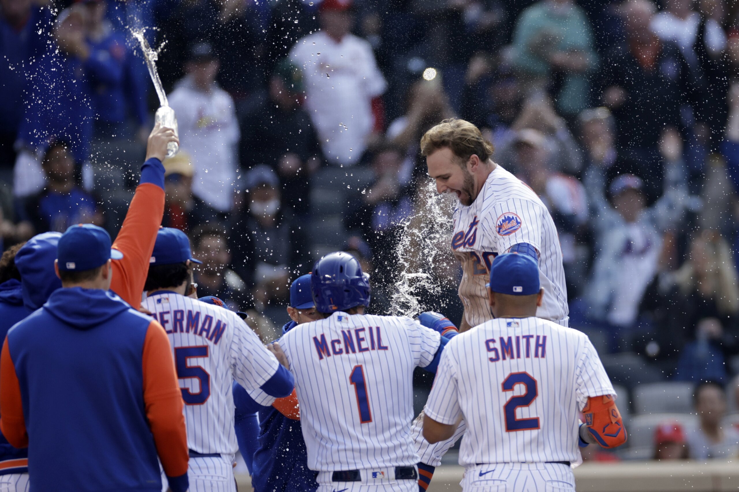 Cards hold off Mets 7-6 in 11 to move into playoff position