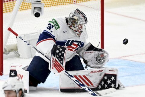 US edges Austria in OT, Canada routs Italy at hockey worlds