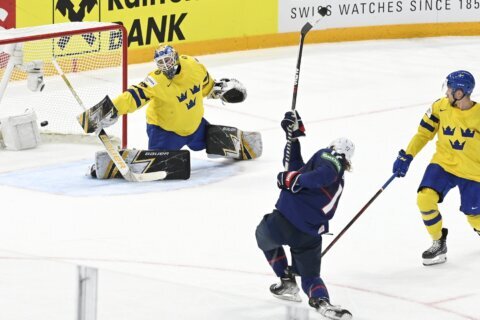 US beats Sweden in overtime at hockey worlds, Canada loses