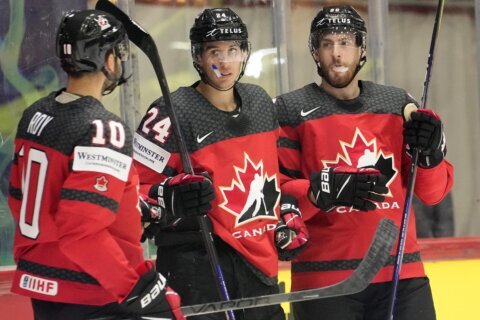 Canada wins at worlds after fire delay, US beats Britain