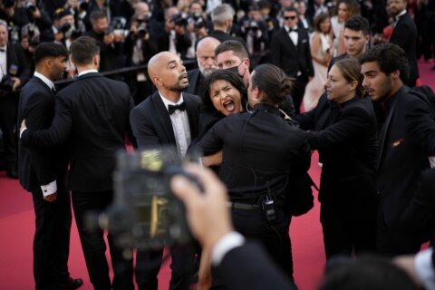 Protester crashes Cannes carpet at George Miller premiere