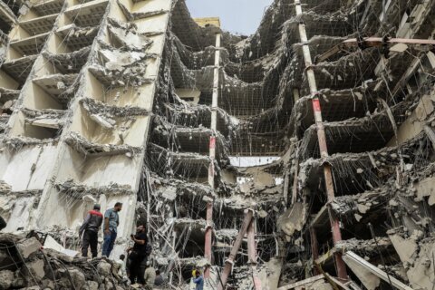 Building collapse death toll in southwest Iran rises to 26