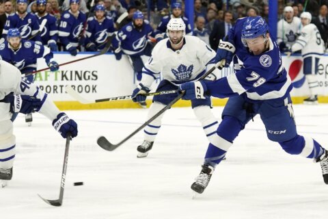 Lightning strike early, beat Maple Leafs 7-3 to even series