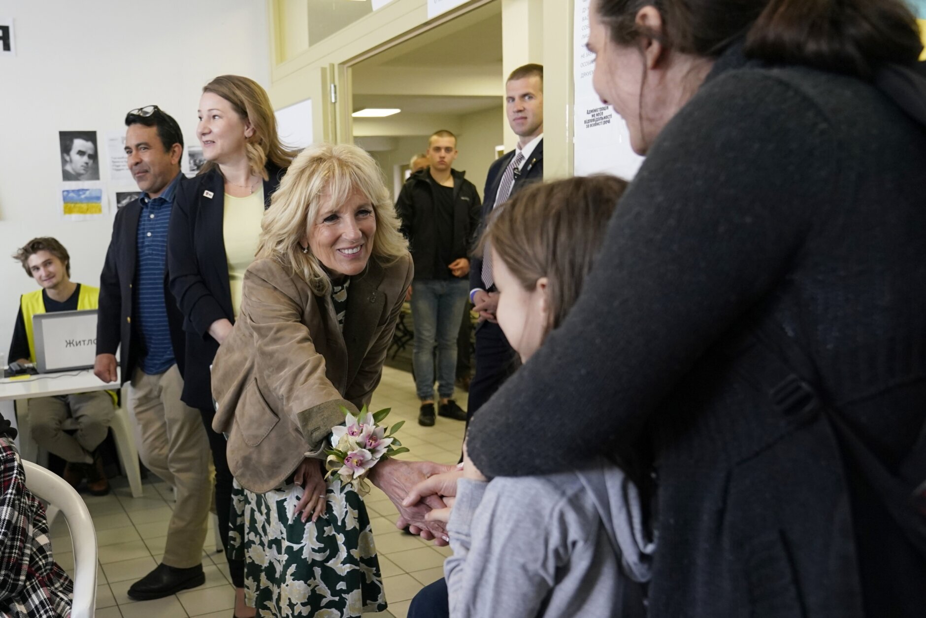 First lady Jill Biden meets Ukrainian refugees Victorie Kutocha and her daughter Yulie Kutocha, 7, at a city-run refugee center in Kosice, Slovakia, Sunday, May 8, 2022. The center is a place for Ukrainian refugees to rest and prepare for onward travel. Biden will then travel to the Slovak border with Ukraine to meet with refugees. (AP Photo/Susan Walsh, Pool)