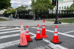 Orange traffic cones being used to block an intersection