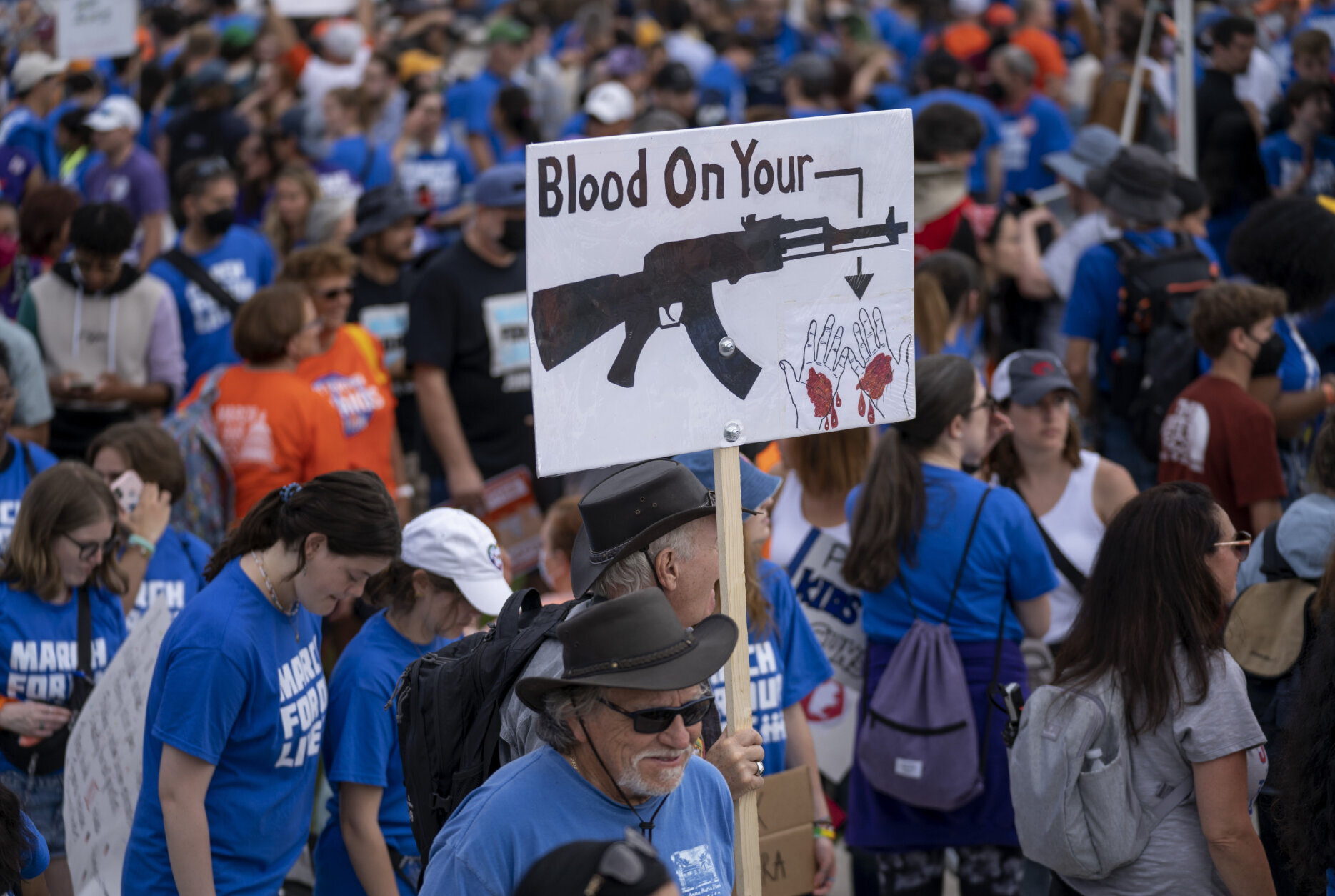 People display placards during the second March for Our Lives rally in support of gun control, Saturday, June 11, 2022, in Washington. The rally is a successor to the 2018 march organized by student protestors after the mass shooting at a high school in Parkland, Fla. (AP Photo/Gemunu Amarasinghe)