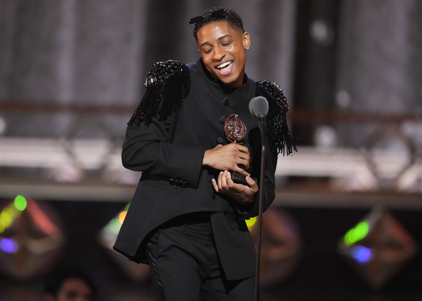 Myles Frost accepts the award for best leading actor in a musical for "MJ" at the 75th annual Tony Awards on Sunday, June 12, 2022, at Radio City Music Hall in New York. (Photo by Charles Sykes/Invision/AP)
