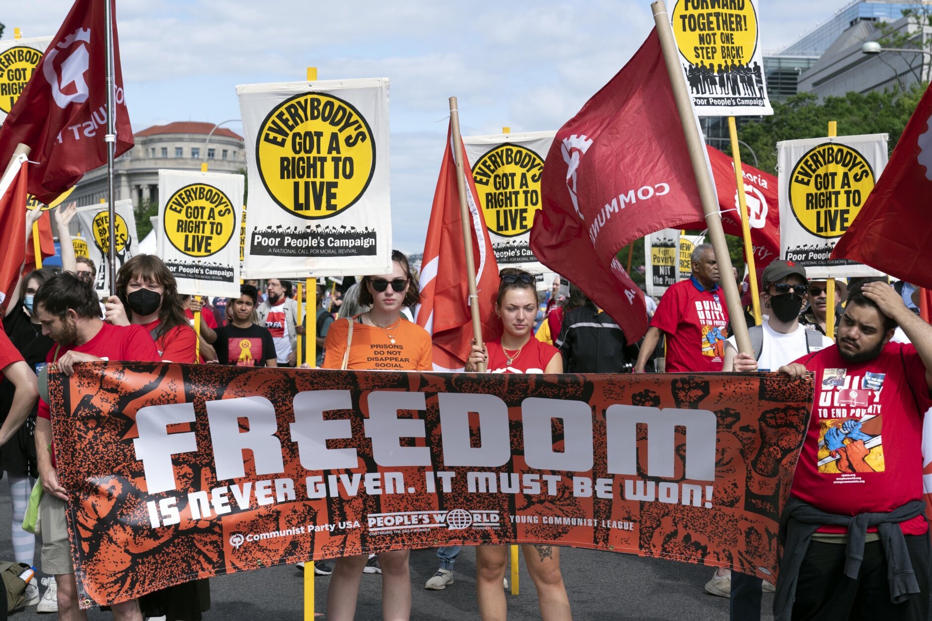 Demonstrators march during the Poor People's Campaign, "Moral March" on Pennsylvania Avenue in Washington, Saturday, June 18, 2022. (AP Photo/Jose Luis Magana)