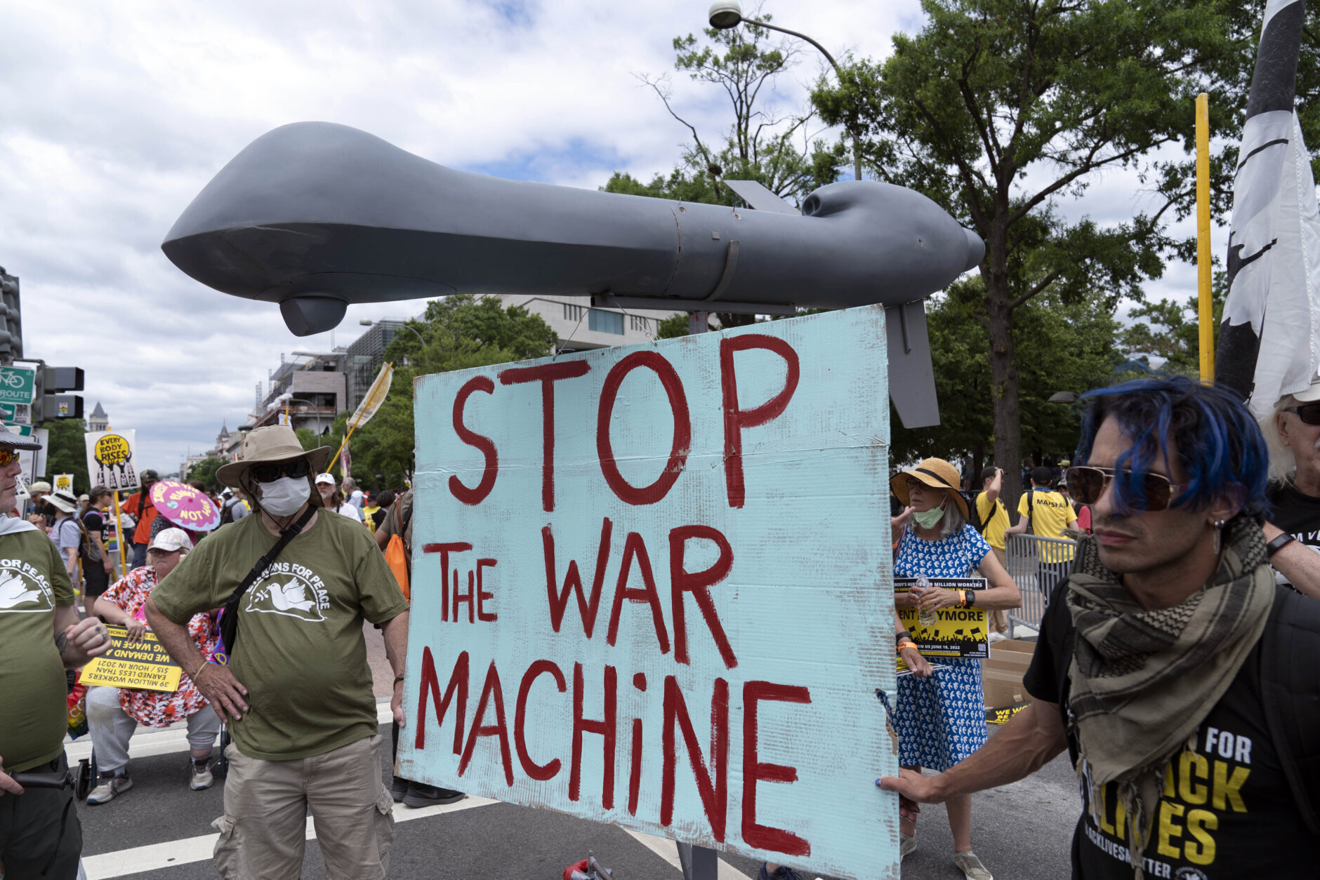 Anti-war demonstrators hold a mock drone as they rally during the Poor People's Campaign, "Moral March" on Pennsylvania Avenue in Washington, Saturday, June 18, 2022. (AP Photo/Jose Luis Magana)