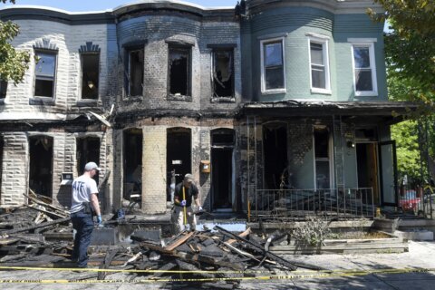 3 hurt in fire in row homes on block where pride flag burned