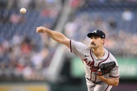 Riley homers twice, Braves win 14th straight, 8-2 over Nats