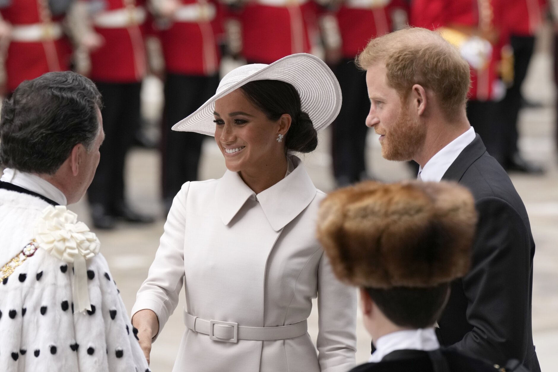 Prince Harry and Meghan Markle, Duke and Duchess of Sussex arrive for a service of thanksgiving for the reign of Queen Elizabeth II at St Paul's Cathedral in London, Friday, June 3, 2022 on the second of four days of celebrations to mark the Platinum Jubilee. The events over a long holiday weekend in the U.K. are meant to celebrate the monarch's 70 years of service. (AP Photo/Matt Dunham, Pool)