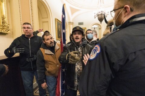 Confederate flag-toting man, son convicted in Capitol riot