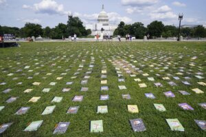 Schoolbooks and broken pencils on the lawn of the U.S. Capitol.