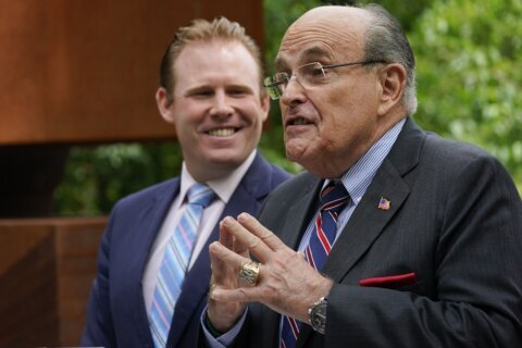 Heckler charged with assault after confronting Rudy Giuliani