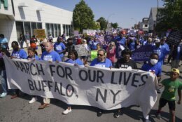 Protesters march down Jefferson Avenue  at the site of the Tops massacre during a March for Our Lives rally in support of gun control, Saturday, June 11, 2022, in Buffalo, N.Y. (Derek Gee/The Buffalo News via AP)