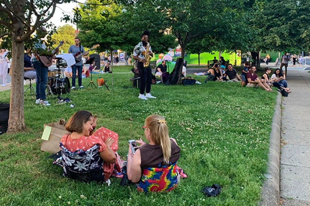 people sitting on grass at the Summer Jazz Series