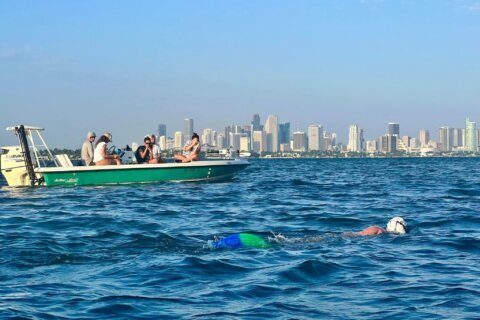 Woman sets record swimming 26.22 miles in a mermaid fin
