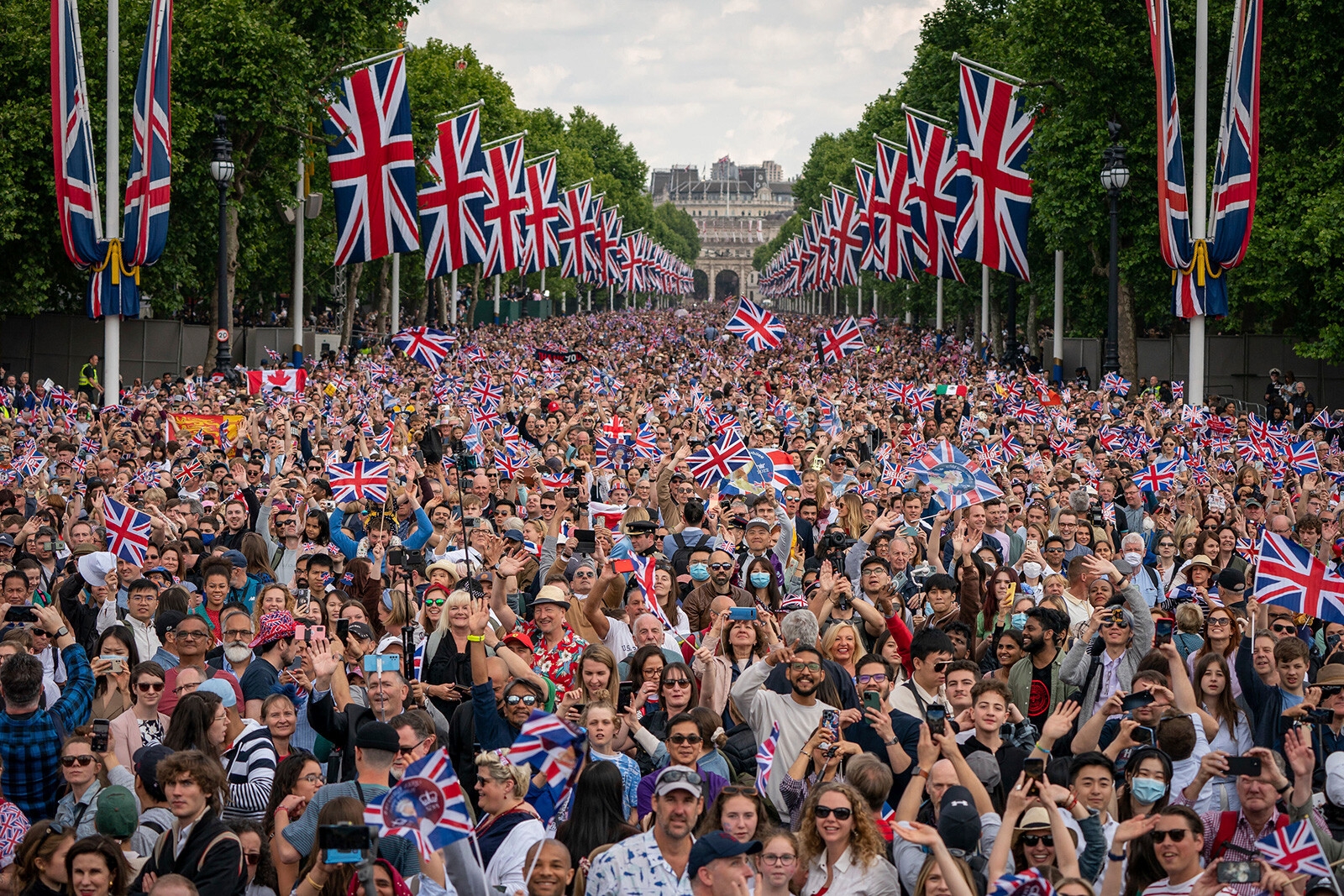 People pack The Mall as the British royal family come onto the balcony of Buckingham Place after the Trooping the Colour ceremony in London on June 2.