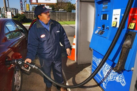 Average US gas price dips below $5 a gallon