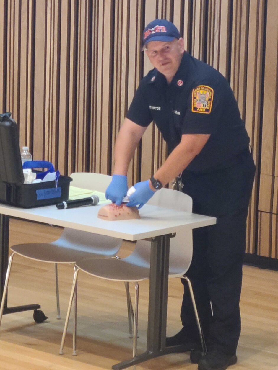 DC EMS Captain Charles Steptoe demonstrates how to pack a gunshot wound during DC Nightlife Active Shooter Preparedness Training.