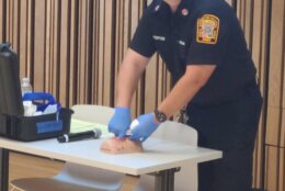 DC EMS Captain Charles Steptoe demonstrates how to pack a gunshot wound during DC Nightlife Active Shooter Preparedness Training.