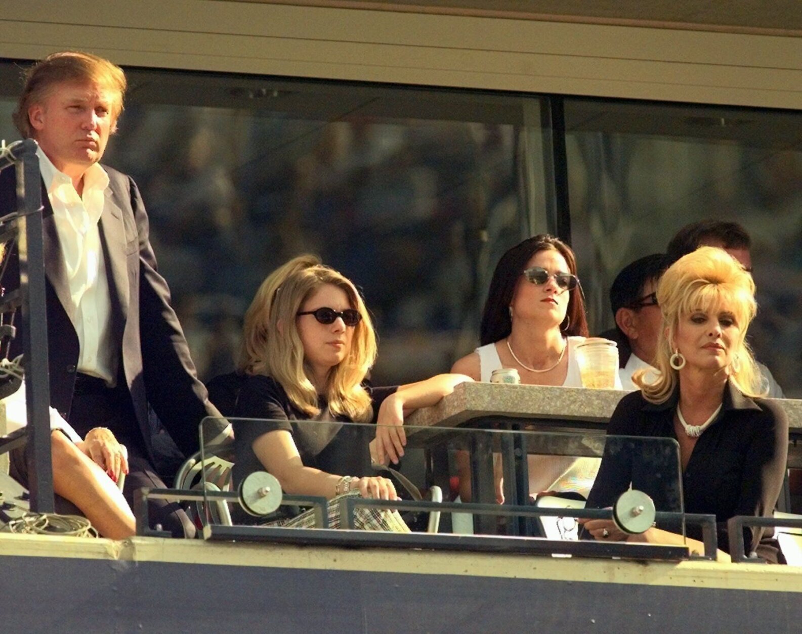 Donald Trump, left, his daughter Ivanka, center, and ex-wife Ivana watch the men's semifinal match from their box at the U.S. Open in New York Saturday, Sept. 6, 1997.   (AP Photo/Richard Drew)
