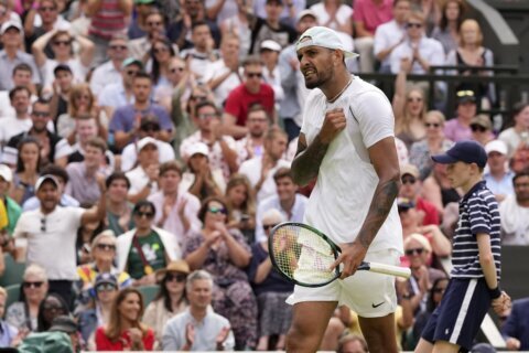 Quieter, calmer Kyrgios in Wimbledon quarters years later