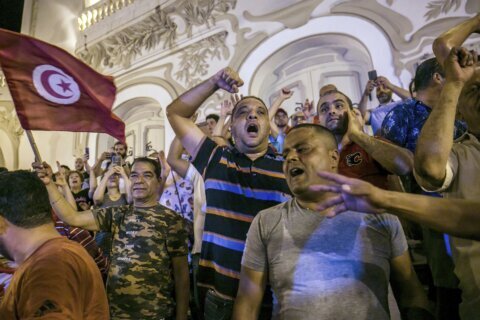New constitution gives some Tunisians hope, others concern