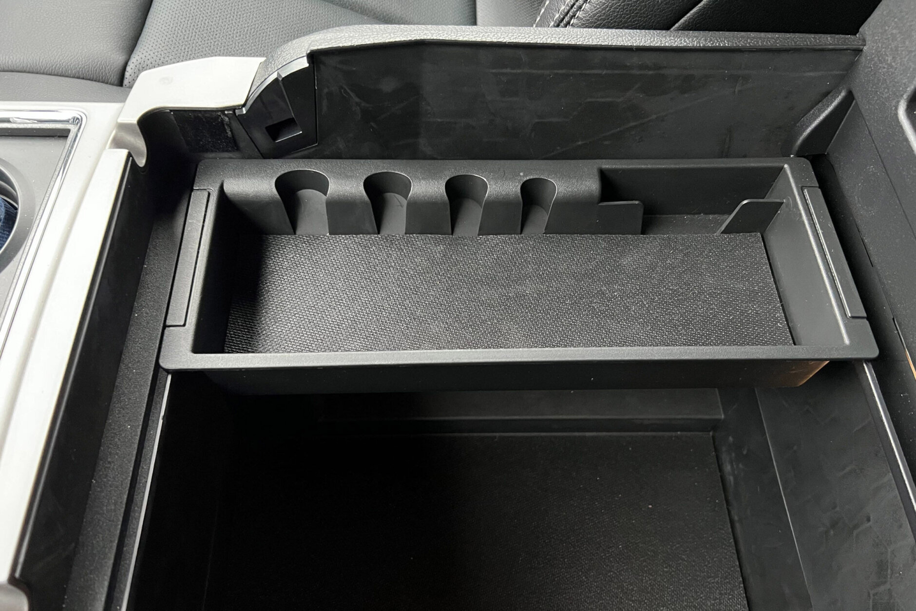 <p>A center console can hold a book bag or laptop with room to spare.</p>
