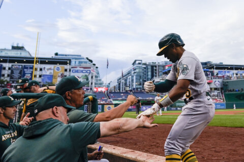 Murphy’s grand slam keys A’s 10-6 win against Nationals