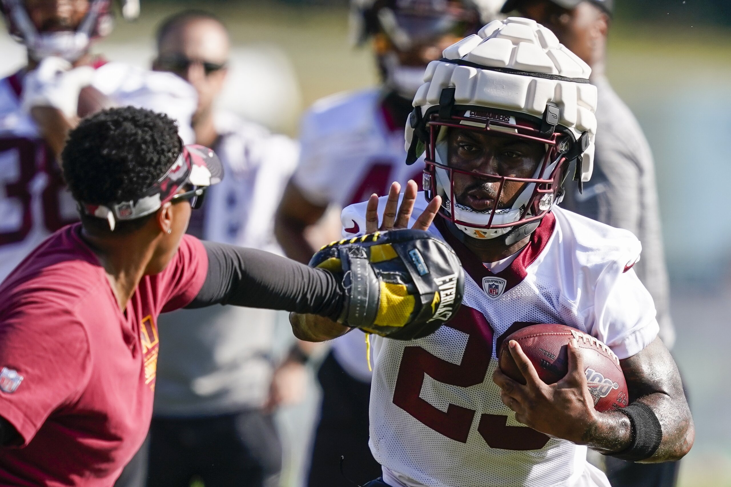 New Orleans Saints players adjust to Guardian Caps during training camp