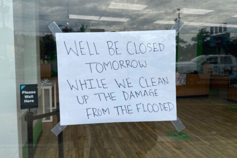 Stores spend another day cleaning up after another flood in Riverdale