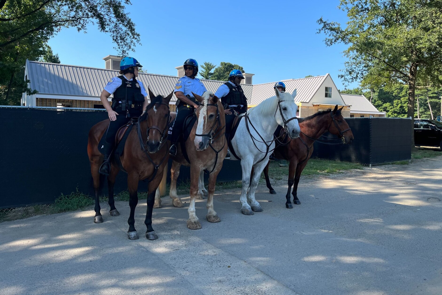 National Park Police sit atop the horses that will utilize the new stables. The project will include a welcome center and public viewing area where visitors can interact with the horses. (WTOP/Nick Iannelli) 