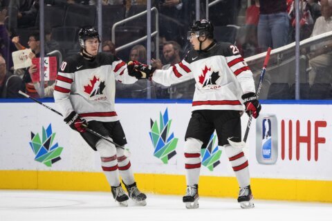 Canada opens world junior hockey with 5-2 win over Latvia