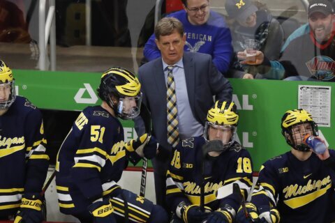 Michigan cuts ties with embattled hockey coach Mel Pearson