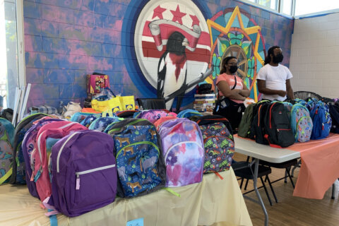 Backpack giveaway gets DC kids ready for school while honoring an old friend