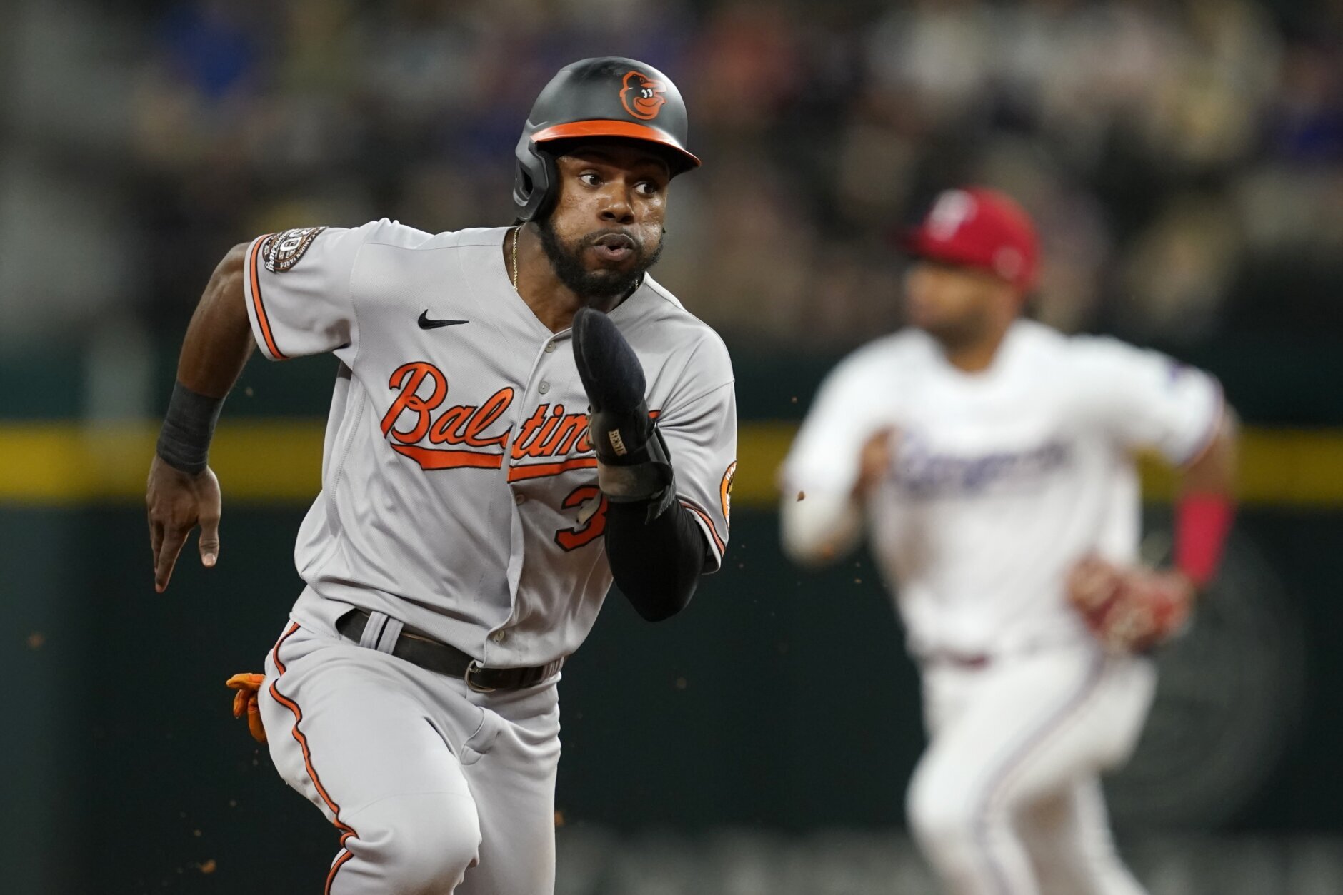 Orioles trade Mancini, then beat Texas 7-2 to match '21 wins